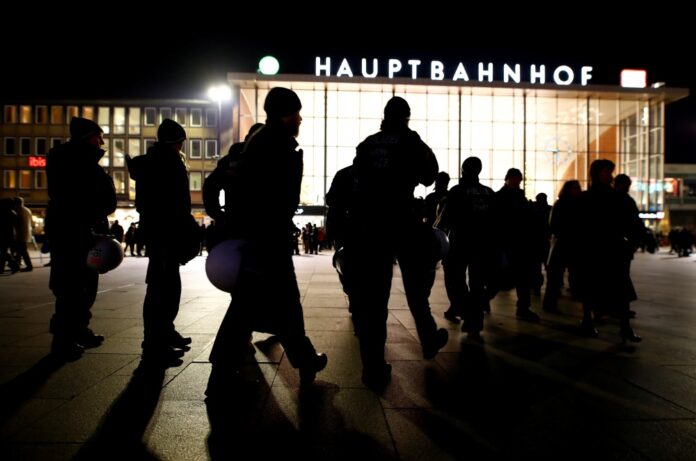 FILE PHOTO - German riot police officers take their positions near the Hauptbahnhof before New Year celebrations for 2017 in Cologne