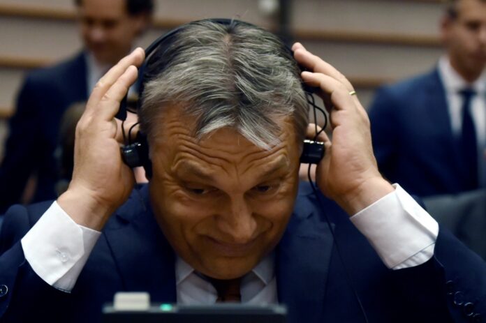 Hungary's PM Orban reacts during a plenary session at the EP in Brussels
