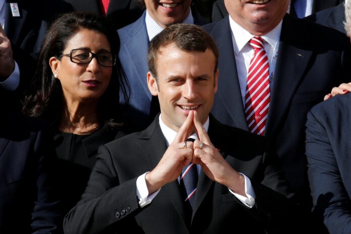 French President Emmanuel Macron attends a family picture with the International Olympic Committee Evaluation Commission at the Elysee Place in Paris