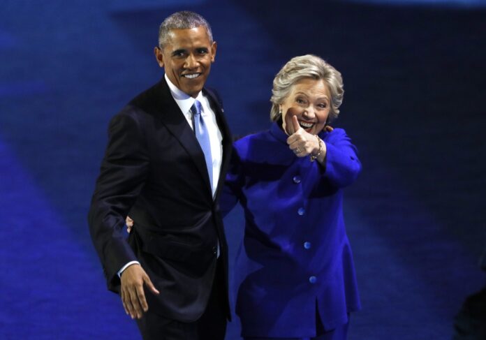 U.S. President Barack Obama and Democratic Nominee for President Hillary Clinton leave the stage at the Democratic National Convention in Philadelphia