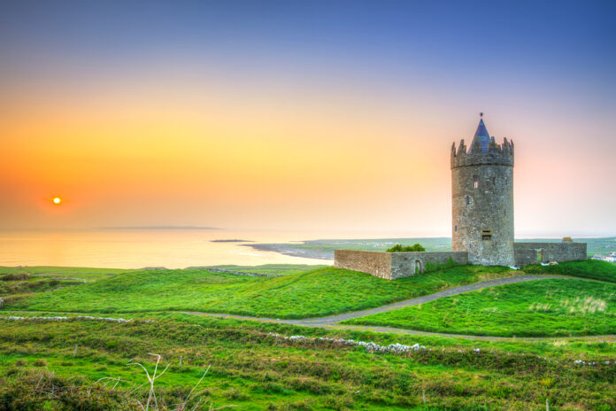 Beautiful irish castle near Atlantic ocean at sunset, Co. Clare