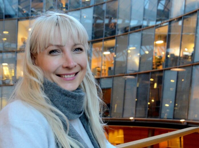 Finns Party deputy chairman and presidential candidate Huhtasaari poses for a picture in Helsinki