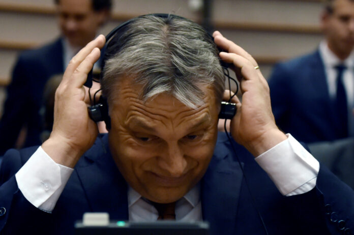 Hungary's PM Orban reacts during a plenary session at the EP in Brussels