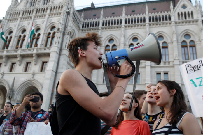 Students shout slogans in front of the Hungarian Parliament during a demonstration against Prime Minister Viktor Orban's efforts to force a George Soros-founded university out of the country in Budapest