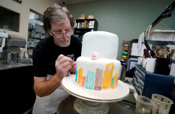 FILE PHOTO: Baker Jack Phillips decorates a cake in his Masterpiece Cakeshop in Lakewood