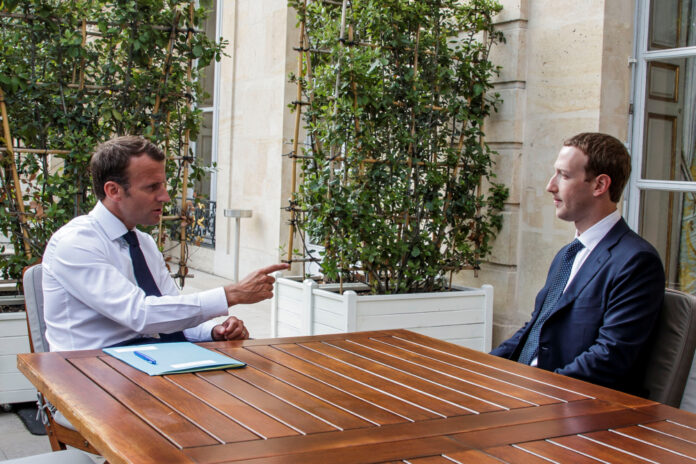 Facebook's founder and CEO Mark Zuckerberg meets with French President Emmanuel Macron at the Elysee Palace after the