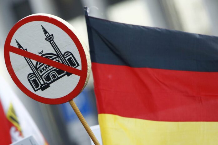 Supporters of anti-immigration right-wing movement PEGIDA protest in Cologne