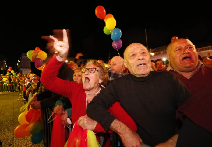 Gay rights activists jeer at opposition members of parliament, who abstained during a vote to recognise same-sex partnerships, in Valletta