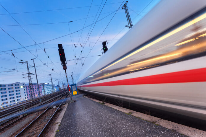 High Speed Passenger Train On Railroad Track In Motion