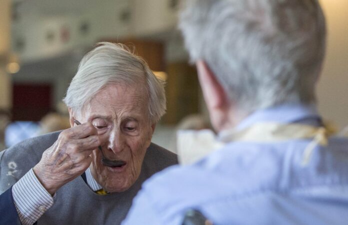 The world's oldest living twin brothers, Pieter and Paulus Langerock from Belgium, eat their lunch in the dining room at the Ter Venne care home in Sint-Martens-Latem