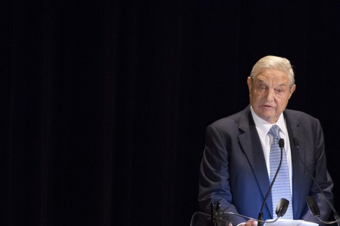 George Soros speaks on stage at the Annual Freedom Award Benefit Event hosted by the International Rescue Committee at the Waldorf-Astoria in New York