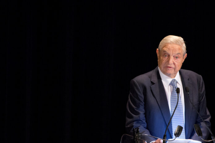 FILE PHOTO: George Soros speaks on stage at the Annual Freedom Award Benefit Event hosted by the International Rescue Committee at the Waldorf-Astoria in New York