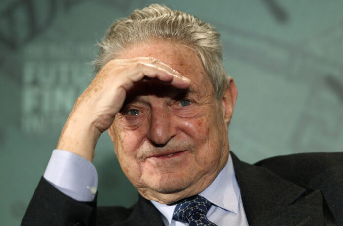 George Soros, Chairman of Soros Fund Management, listens during a Future of Finance Initiative conference in Horsham, southern England