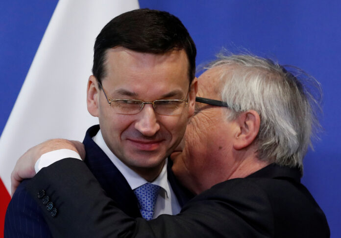 Poland's Prime Minister Morawiecki is welcomed by European Commission President Juncker in Brussels