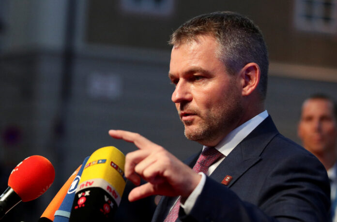 FILE PHOTO: Slovak Prime Minister Peter Pellegrini speaks to the media as he arrives for a meeting of European Union leaders in Salzburg