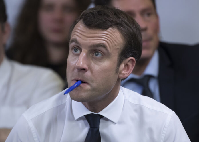 Macron attends National Debate outside Paris